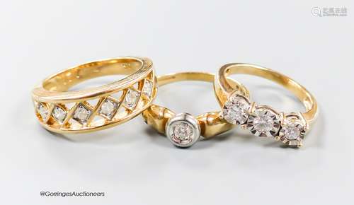 Three assorted modern 9ct gold and diamond set dress rings, ...