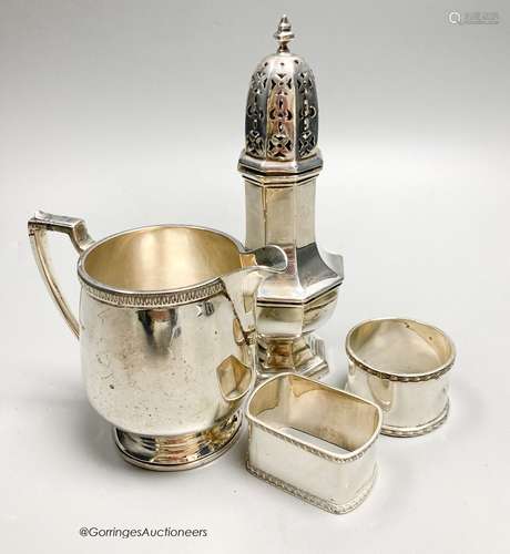 A George V silver jug, Birmingham, 1928, a silver caster and...