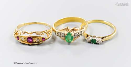 Three assorted modern 18ct gold and gem set rings, including...