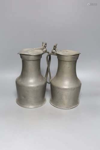 An 18th century French lidded pewter jug with double acorn t...