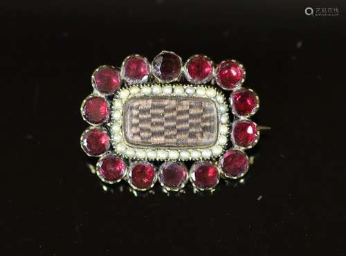 A 19th century gold plated, garnet and seed pearl set mourni...