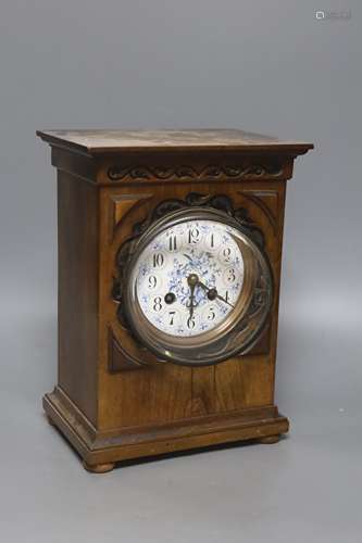 An Edwardian walnut mantel clock, with decorative dial, heig...