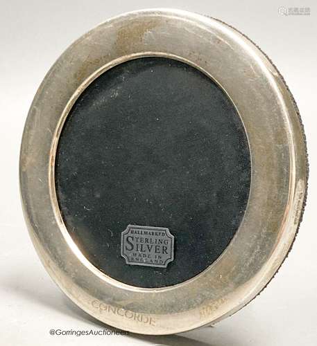 A modern silver mounted circular photograph frame, engraved ...