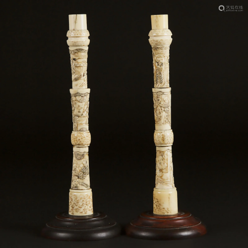 A Pair of Japanese Carved Bone 'Figural' Candlesticks,