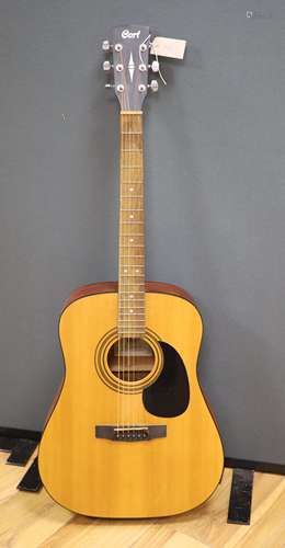 A Cort acoustic guitar