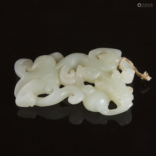 A Carved White Jade Archaistic 'Dragon' Pendant,