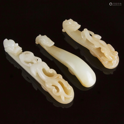 A Group of Three White and Pale Russet Jade Belt Hooks,