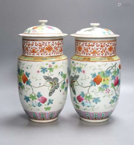 A pair of 19th century Chinese famille rose vase and covers,...