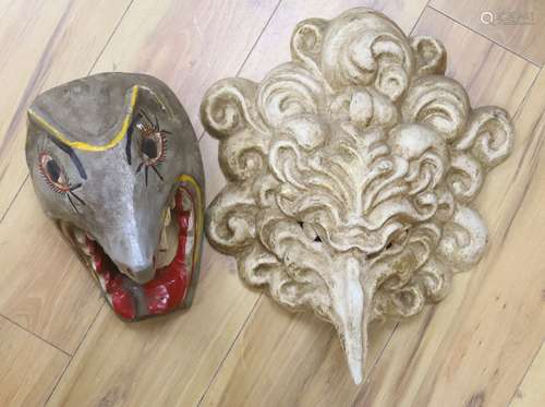 A Venetian gilded papier mache grotesque mask, 46cm, and a p...