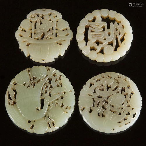 A Group of Four Pale Celadon Jade Circular Plaques,