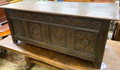 A 17th century carved oak coffer, length 140cm, depth 53cm, ...