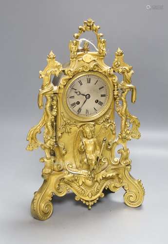 A 19th century French ormolu mantel clock, mounted with an a...