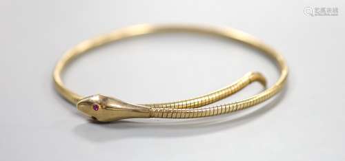 An early to mid 20th century 9ct coiled serpent bracelet, wi...