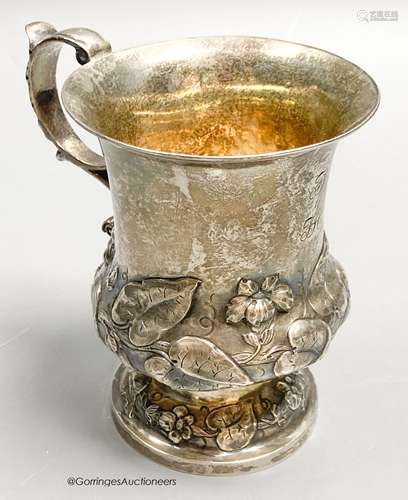 An early Victorian silver vase shaped christening mug, embos...