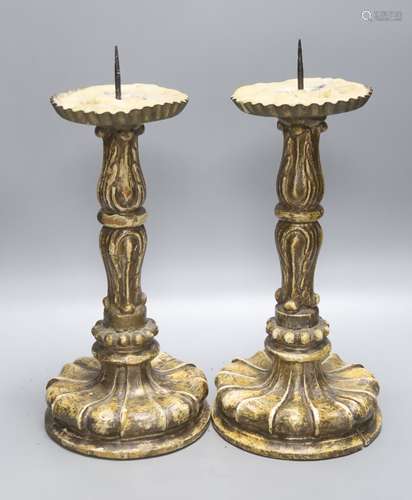 A pair of giltwood and gesso pricier candlesticks in the 17t...