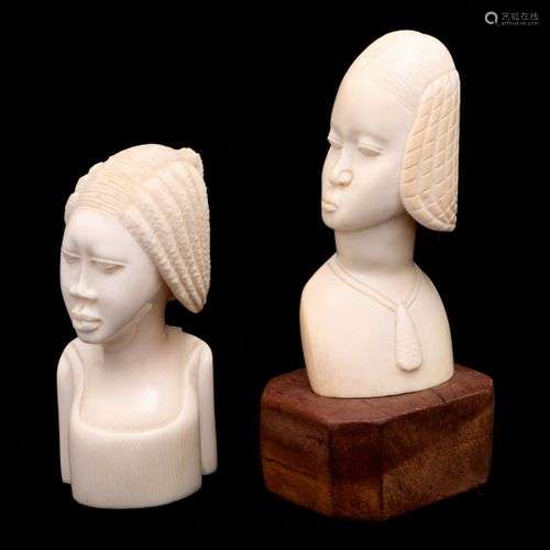 TWO FEMALE HEADS WITH HAIRDRESSES