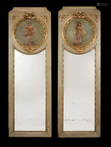 A pair of Continental grey painted and parcel gilt wall mirr...
