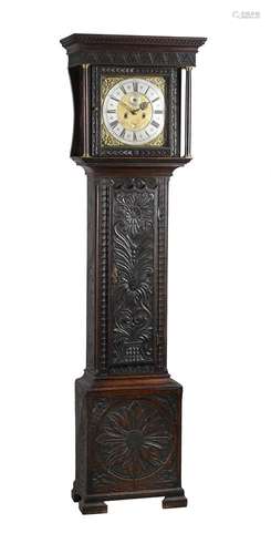 A carved oak longcase clock