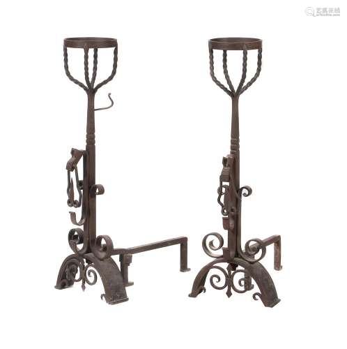 A pair of wrought iron andirons in late 17th century taste