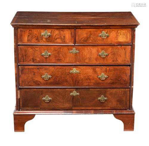 A walnut and cross banded chest of drawers