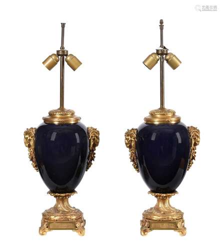 A pair of blue porcelain and gilt metal mounted table lamps