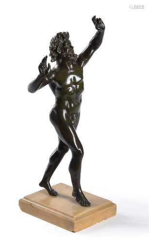 A green patinated bronze figure of The Dancing Faun of Pompe...