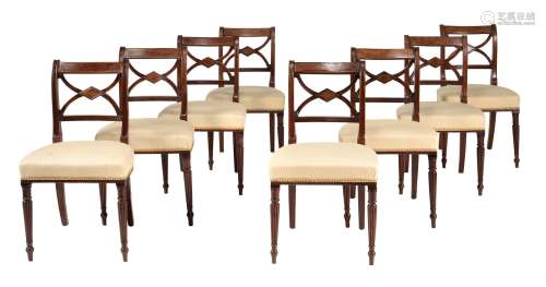 A set of eight Regency mahogany and brass inlaid dining chai...