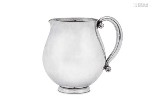 An early 20th century Danish sterling silver cream jug, Cope...