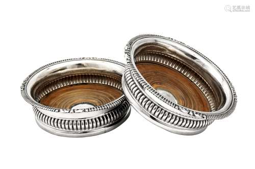 A pair of George IV sterling silver wine coasters, Sheffield...