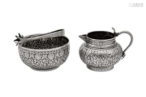 A late 19th century Indian unmarked silver milk jug and suga...