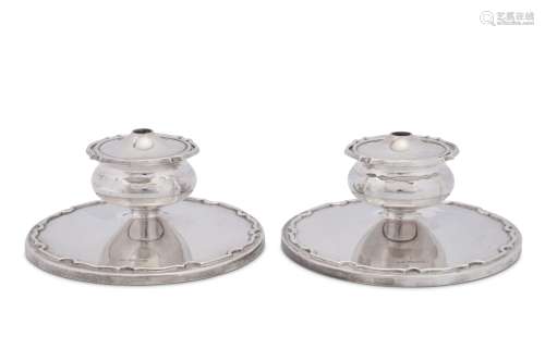 A pair of Elizabeth II combination dwarf candlesticks and ta...