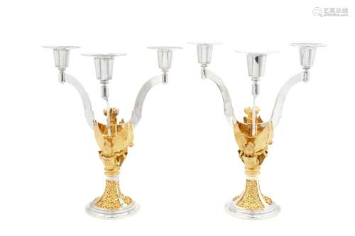 A pair of Elizabeth II parcel gilt sterling silver three lig...