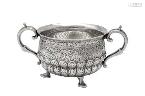 A late 19th century Anglo – Indian unmarked silver twin hand...