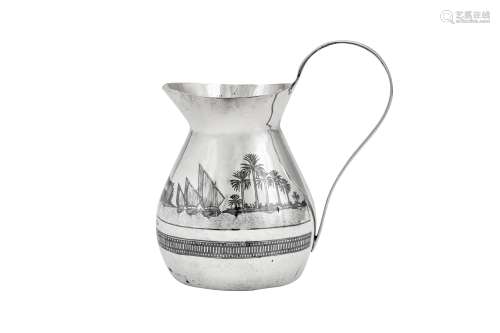An early 20th century Iraqi silver and niello milk jug, circ...