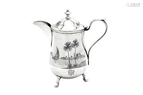 An early 20th century Iraqi silver and niello coffee pot, Om...