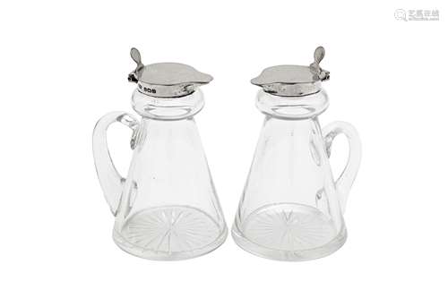 A pair of George VI sterling silver mounted glass whiskey no...