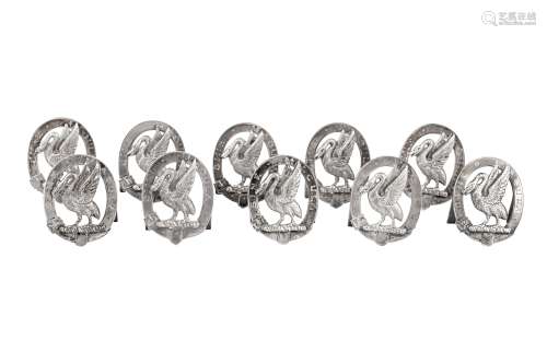 A set of ten Victorian sterling silver place card holders, f...