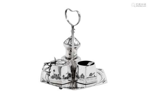 An early 20th century Iraqi silver and niello cruet on stand...