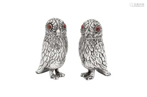 A pair of early 20th century unmarked silver novelty owl pep...