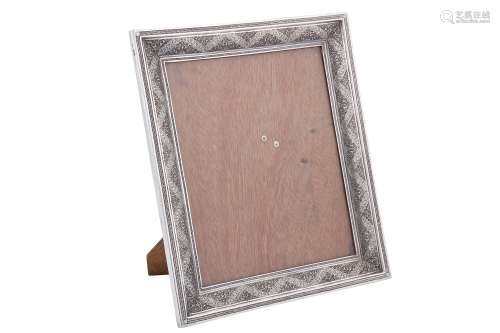 A mid-20th century Iranian (Persian) silver photograph frame...