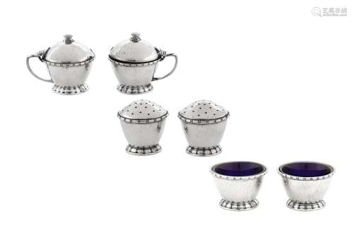 An Edward VIII 'Arts and Crafts' sterling silver six-piece c...