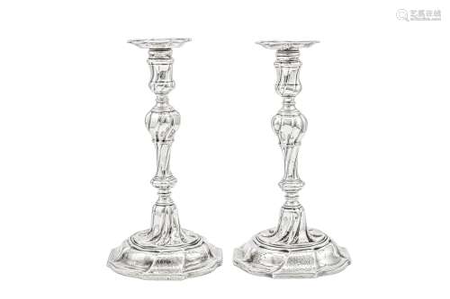 An unusual pair of George II sterling silver candlesticks, L...