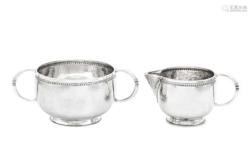 A George V ‘Arts and Crafts’ sterling silver strawberry set,...