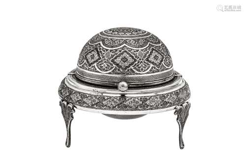 A mid-20th century Iranian (Persian) silver revolving ashtra...