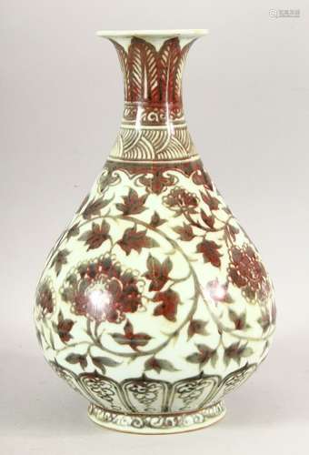 A CHINESE IRON RED BULBOUS VASE, decorated with floral patte...