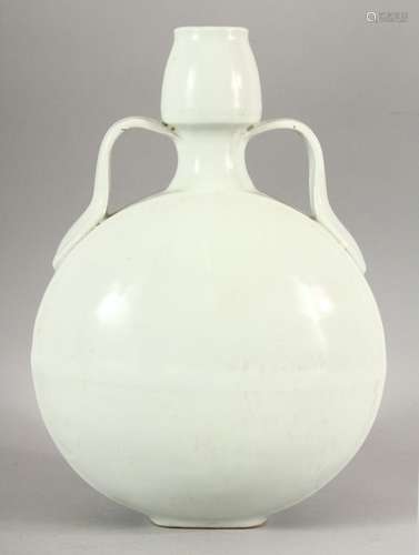 A CHINESE BLANC DE CHINE TWIN HANDLE MOONFLASK, with curving...