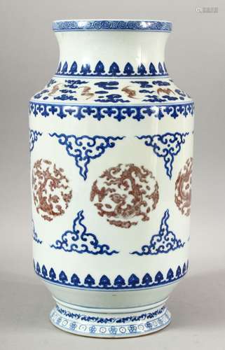 A CHINESE BLUE AND RED VASE, painted with bats, dragons and ...