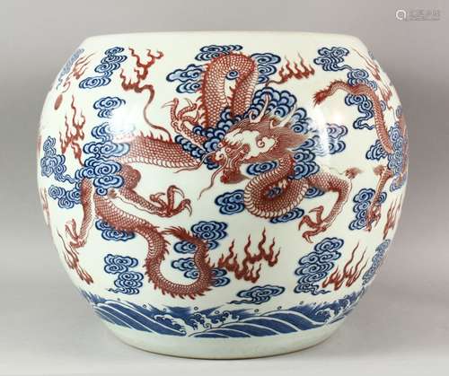 A VERY LARGE CHINESE DRAGON FISH BOWL, painted with iron red...