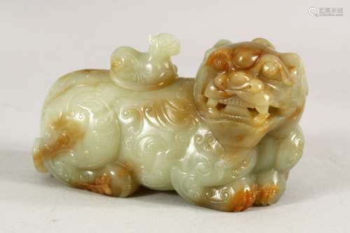 A VERY GOOD CHINESE CARVED JADE LION DOG, 12cm long.