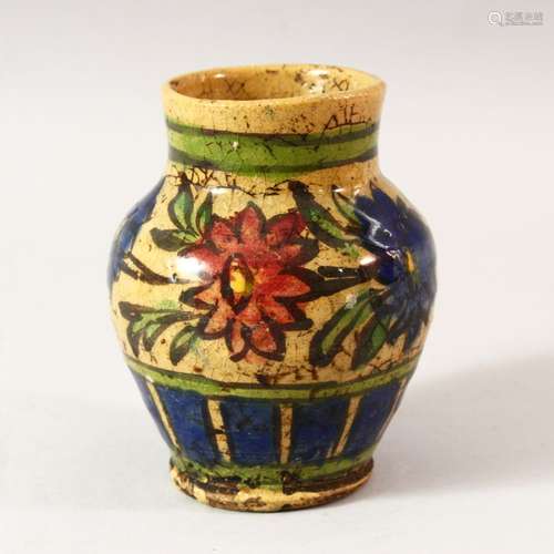 A SMALL ISLAMIC STYLE GLAZED POTTERY VASE, 12.5cm high.